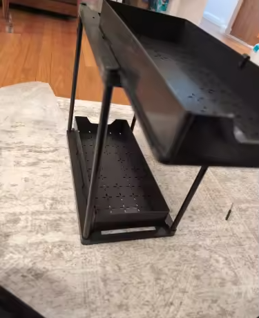 Pull out organiser assembled on a rug
